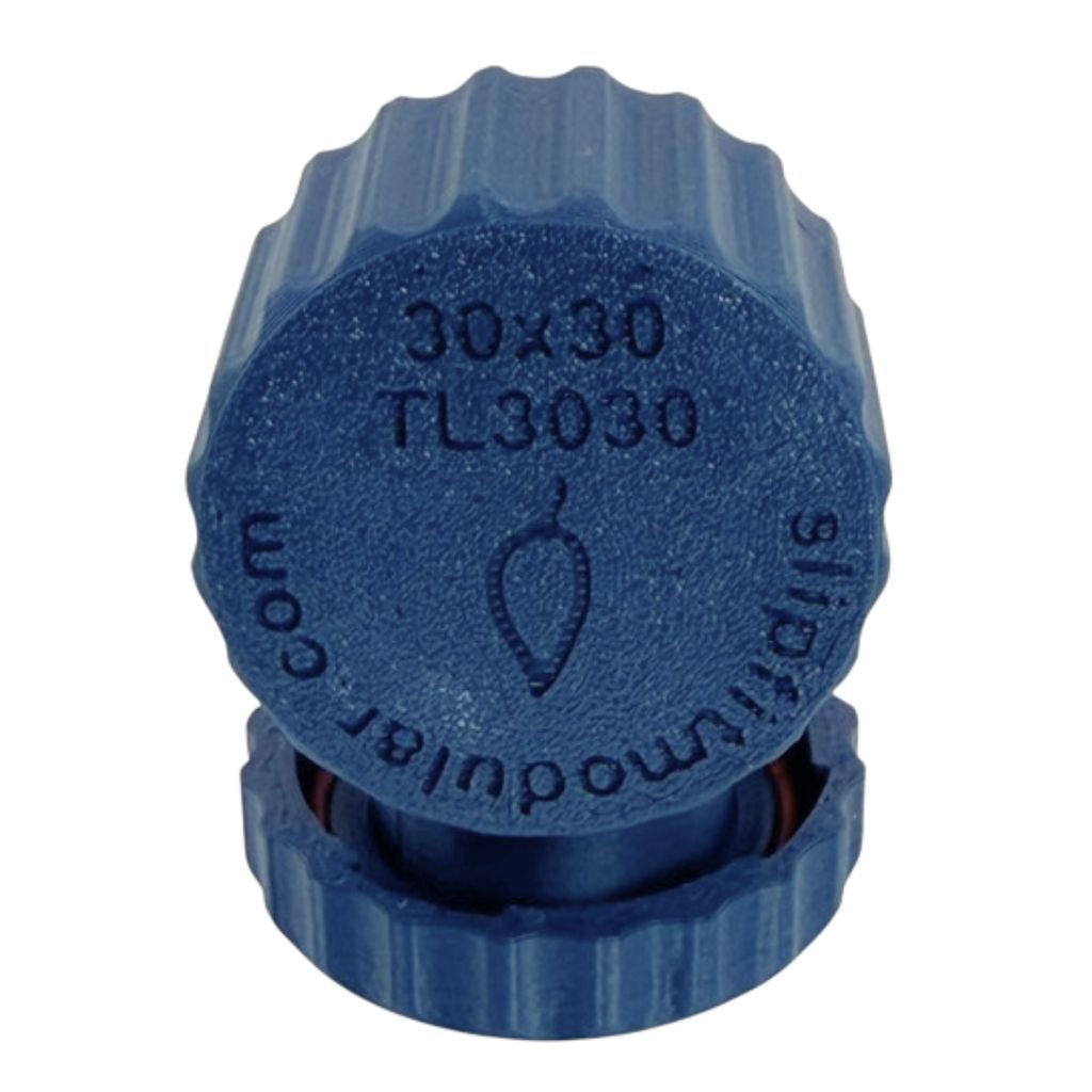 TwistLock metal clay canister with removable lid shown open and closed on a light wood work surface