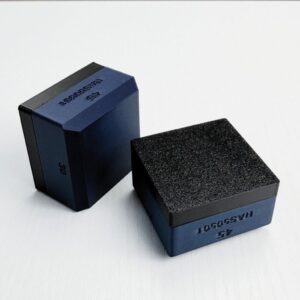 SlipFit GripBlock with navy body and textured black work surface, shown upright and flat.