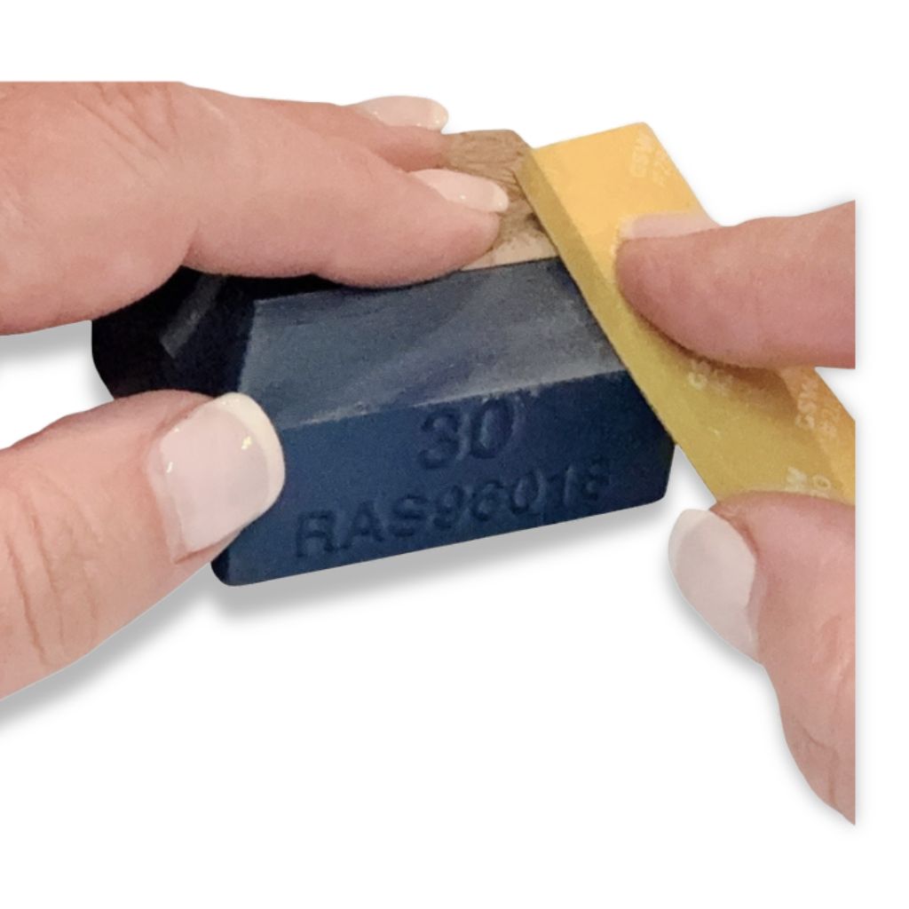 Sanding pads shown with the Quad Angle sanding block